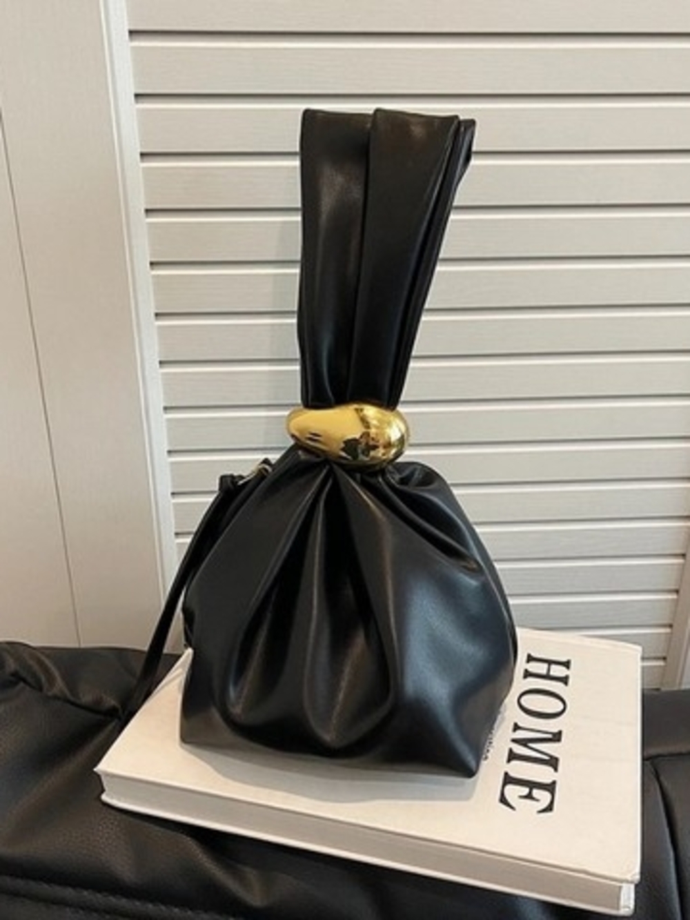 Black Knot-Handle Wristlet Clutch with Gold Accent